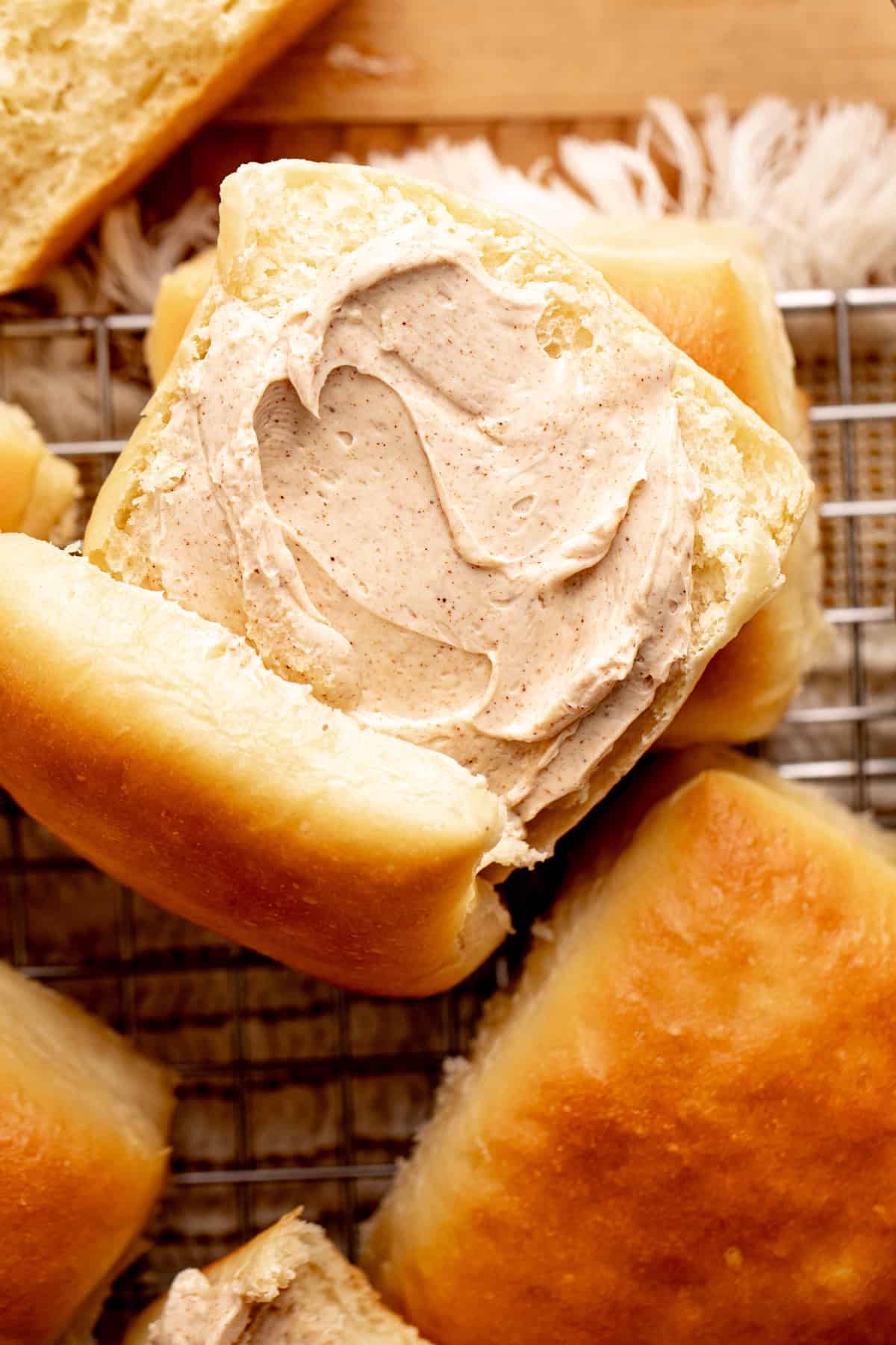 Texas Roadhouse roll with whipped cinnamon honey butter in the center.