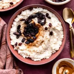 Servings of creamy old fashioned rice pudding topped with raisins.
