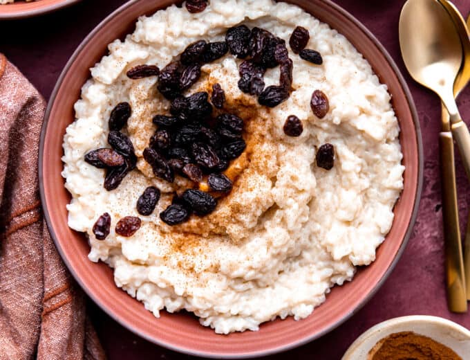 Servings of creamy old fashioned rice pudding topped with raisins.
