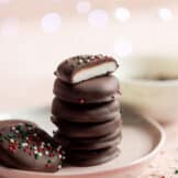 Stack of homemade peppermint patties with sprinkles on top.