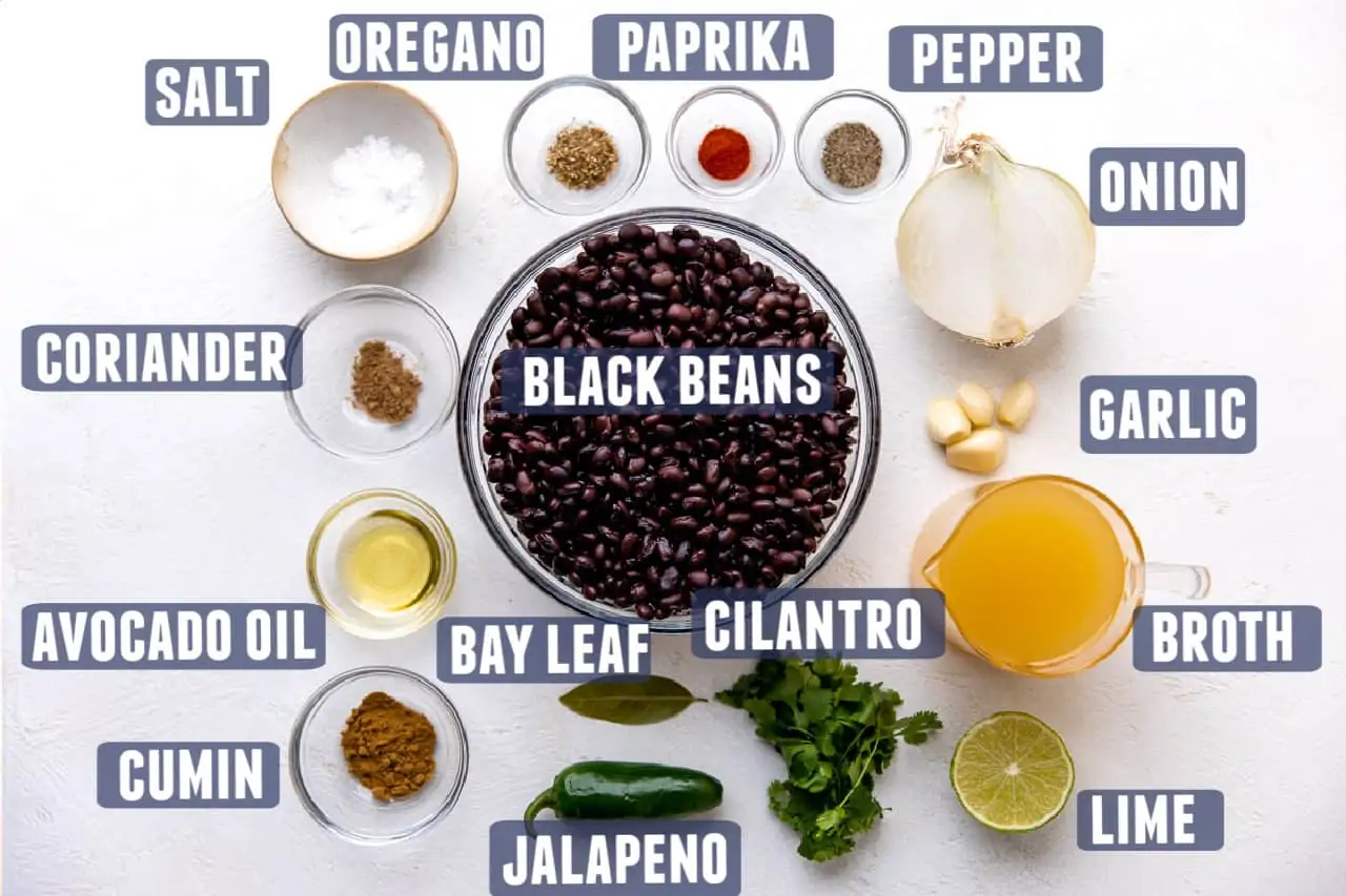 Ingredients needed for making black bean soup laid out on the counter.