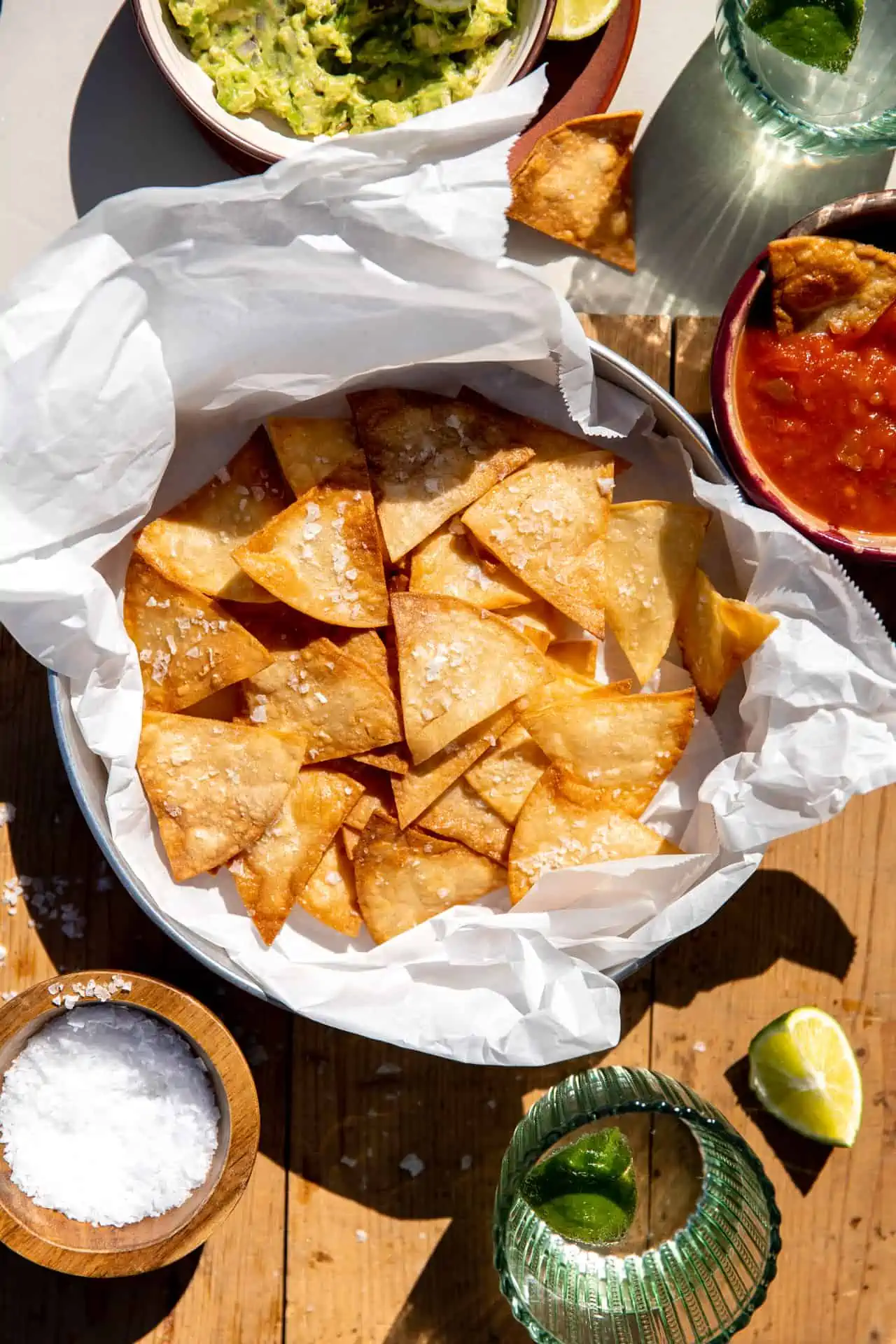 Homemade tortilla chips served with salsa and guacamole.