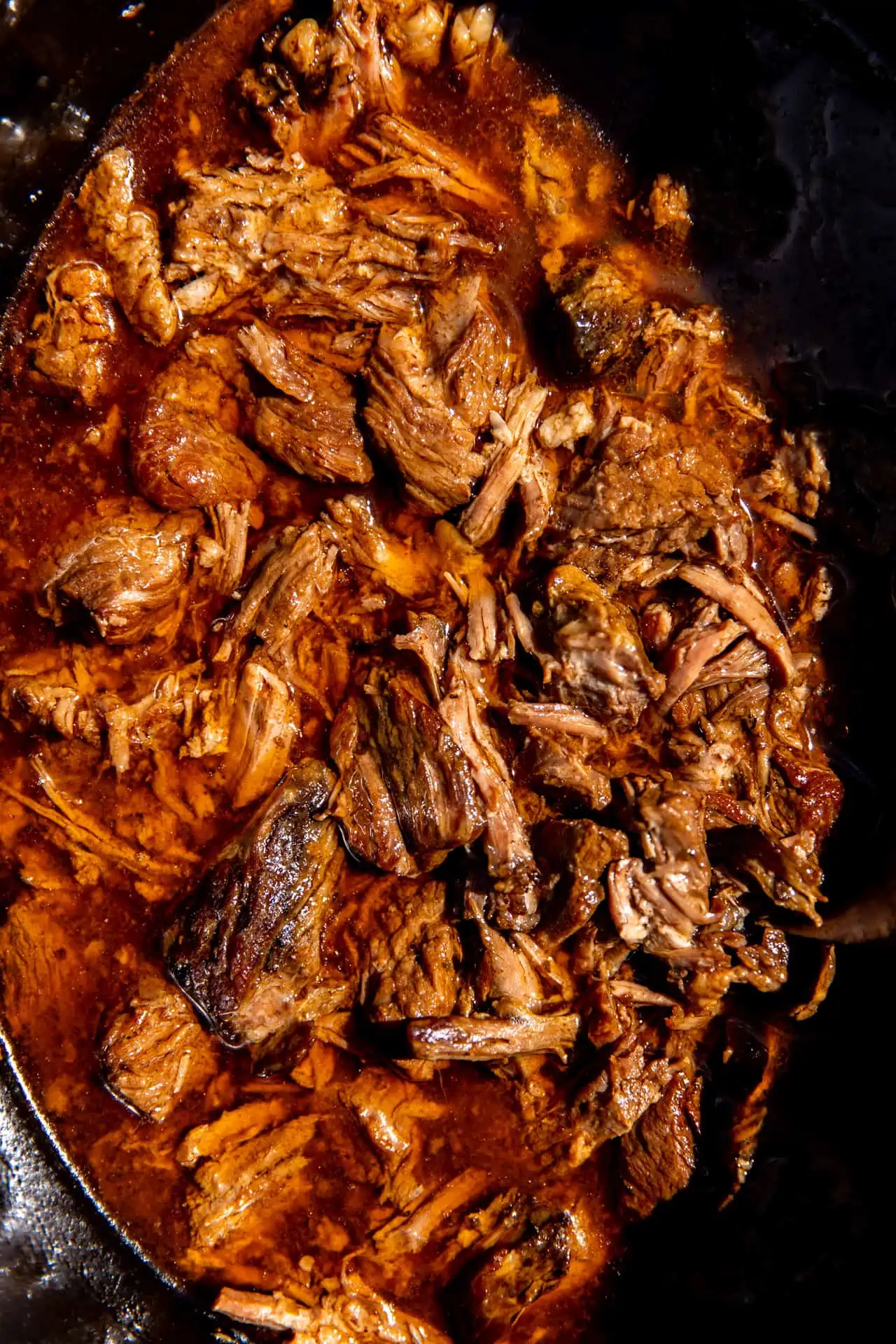 Slow Cooker filled with shredded Mexican style beef.