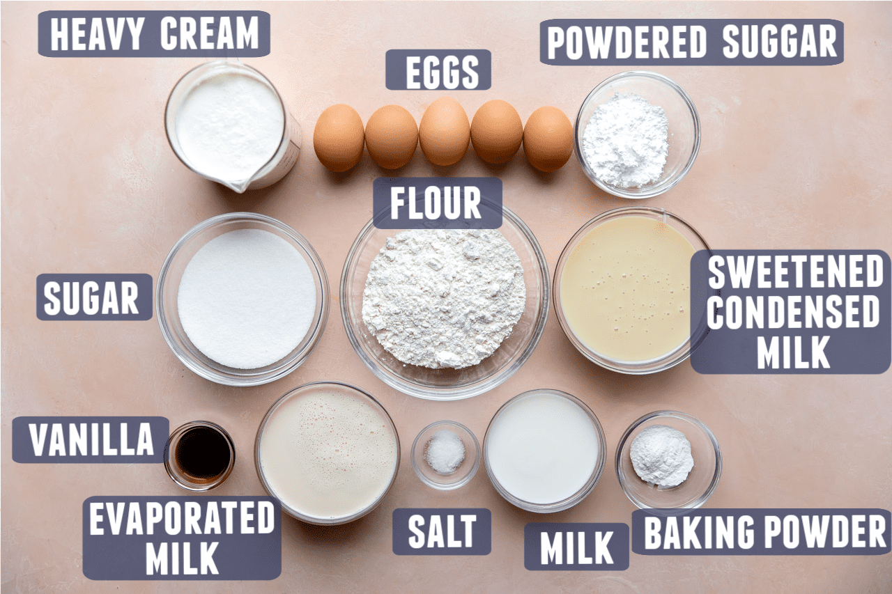 Ingredients needed to make homemade tres leches cake laid out on the counter. 