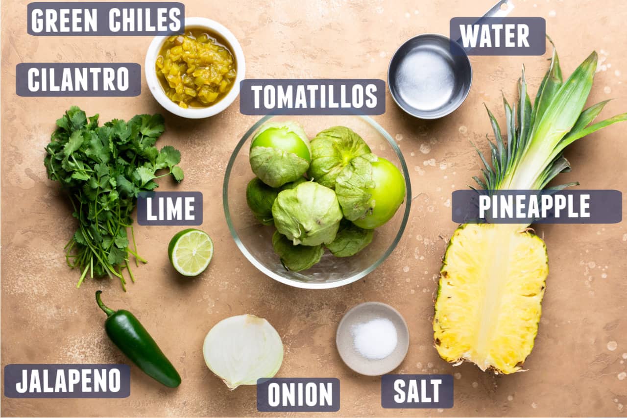Ingredients needed to make blended pineapple salsa laid out on counter.