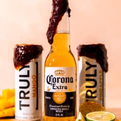 Chamoy rim paste on a bottle of corona and two cans of truly mango and pineapple.