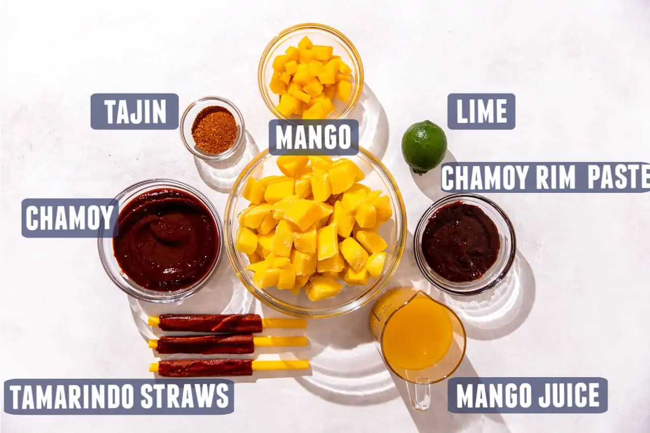 Ingredients needed to make homemade mangonada laid out on the counter. 