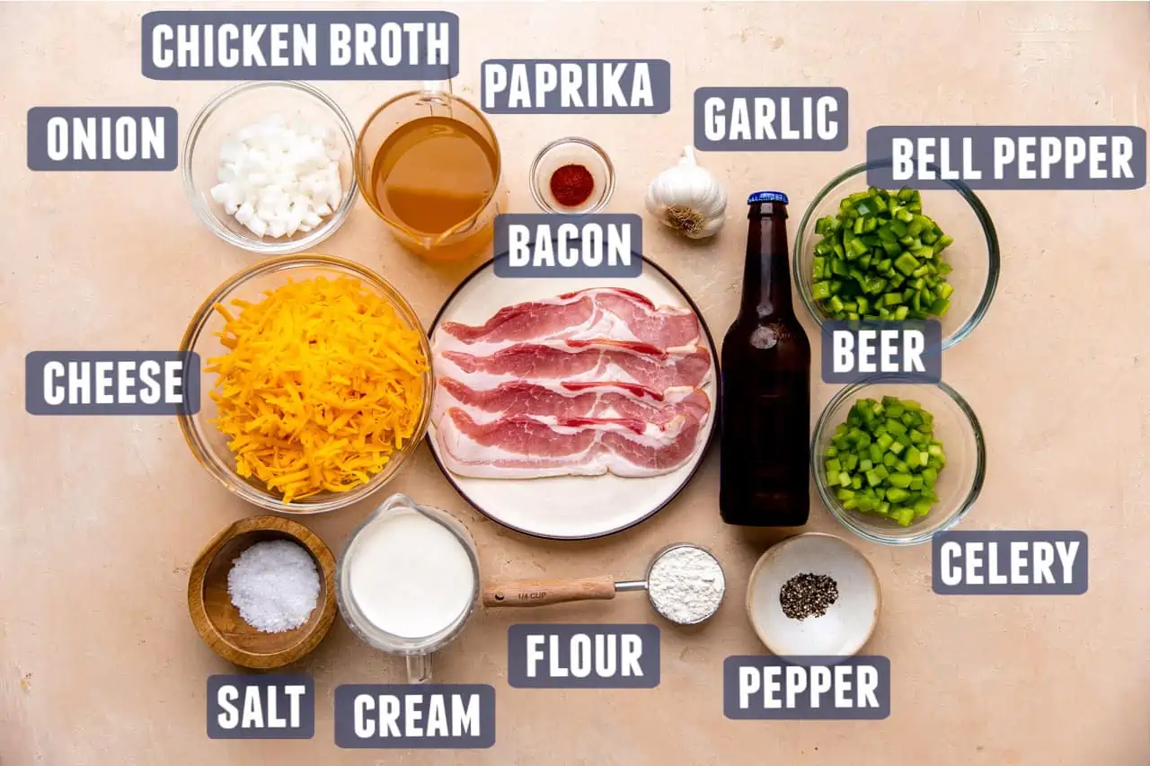 Ingredients needed to make beer cheese soup laid on the counter. 
