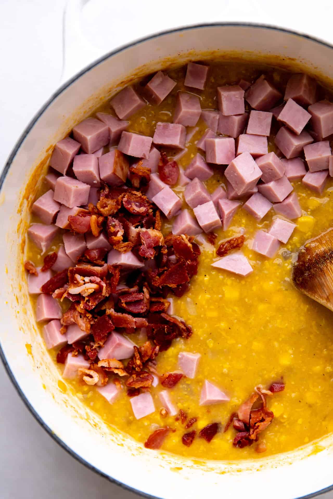 How to make corn chowder, adding bacon and ham back into blended thick, creamy corn chowder. 