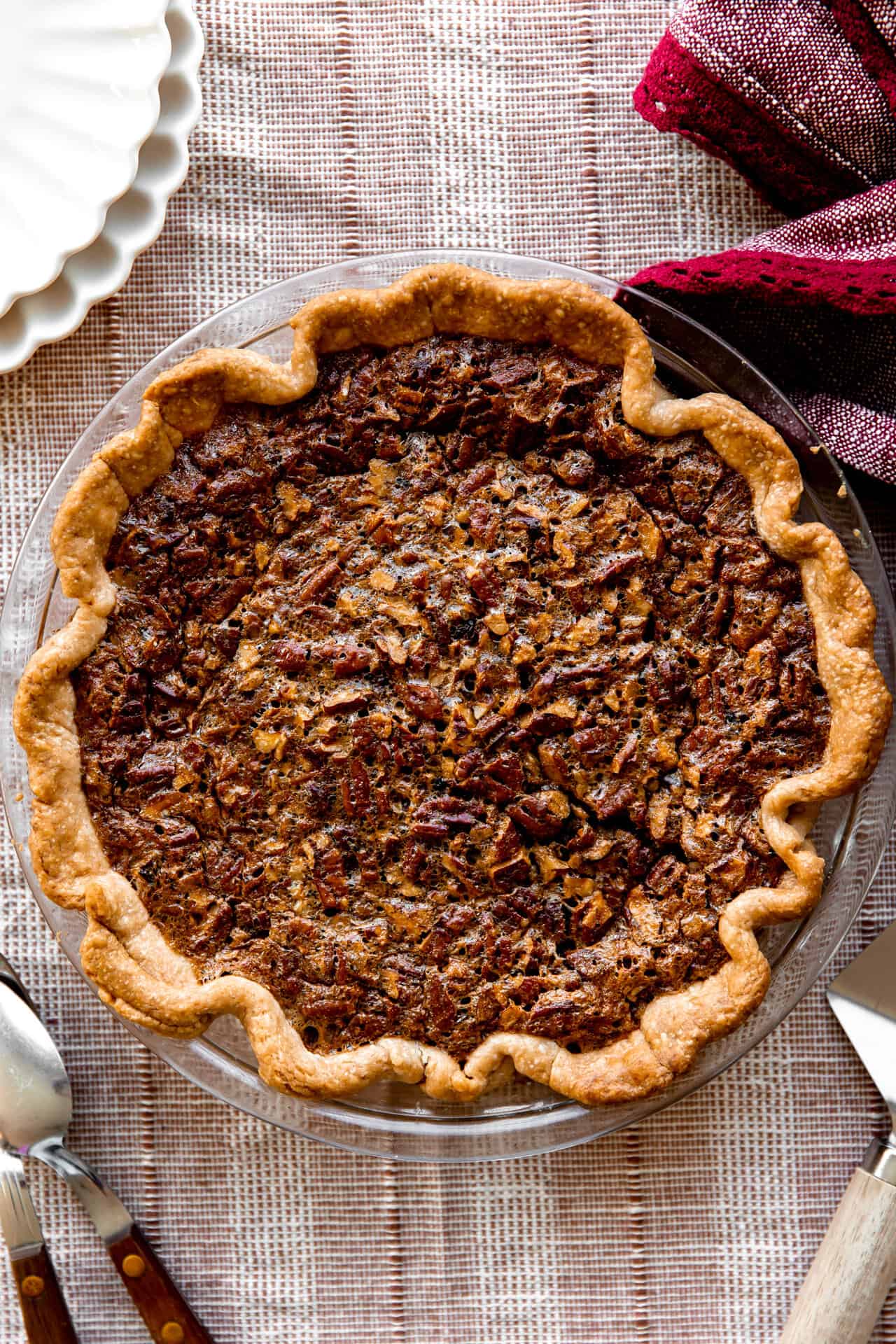 Baked pecan pie in a glass pie dish.