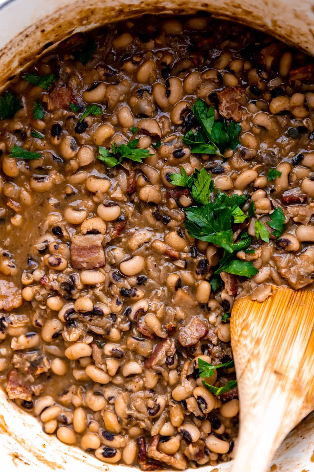 up close view of cooked black eyed peas topped with cilantro. 