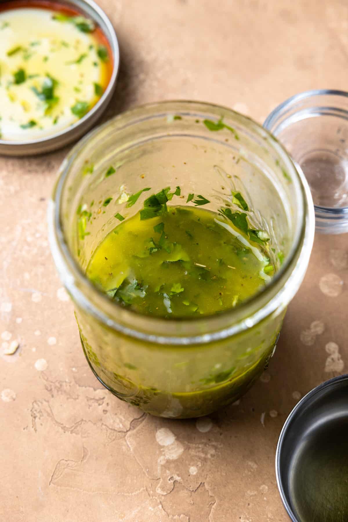 Cilantro Lime Vinaigrette for Cowboy Caviar in a jar after mixing. 