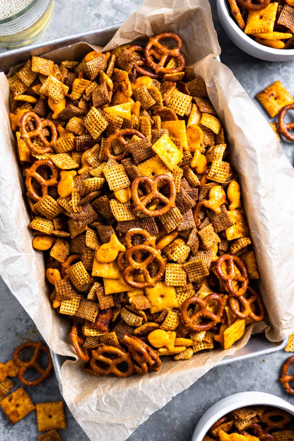 Tray filled with spicy Chex mix. 