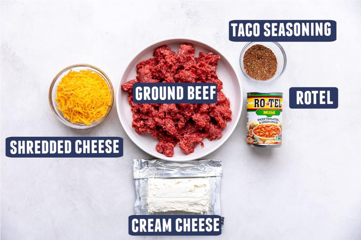 Ingredients needed to make rotel dip with cream cheese laid out on the counter. 