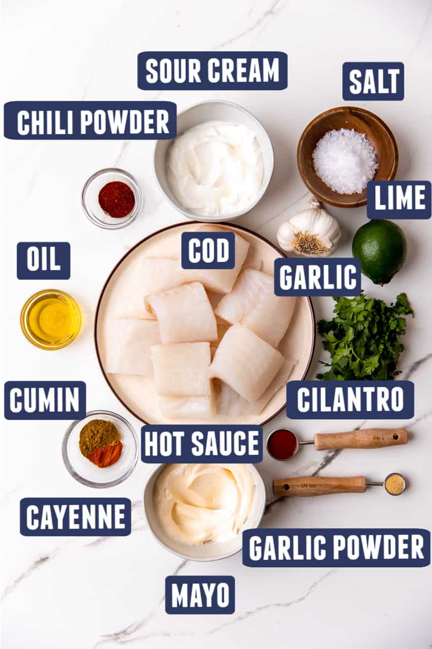 Ingredients needed to make healthy cod fish tacos laid on counter.