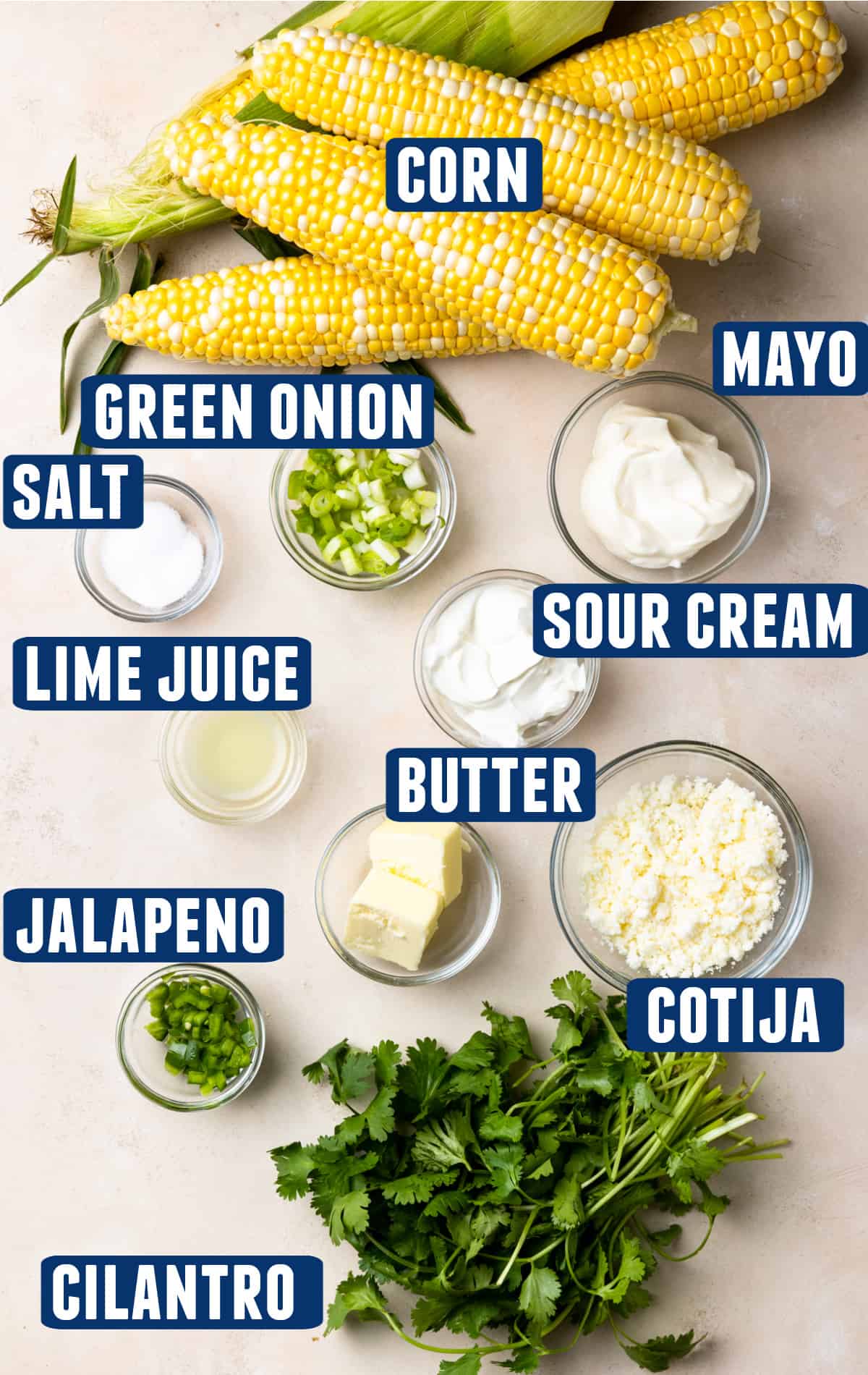 Ingredients needed to make an elote mexican street corn salad laid on the counter.
