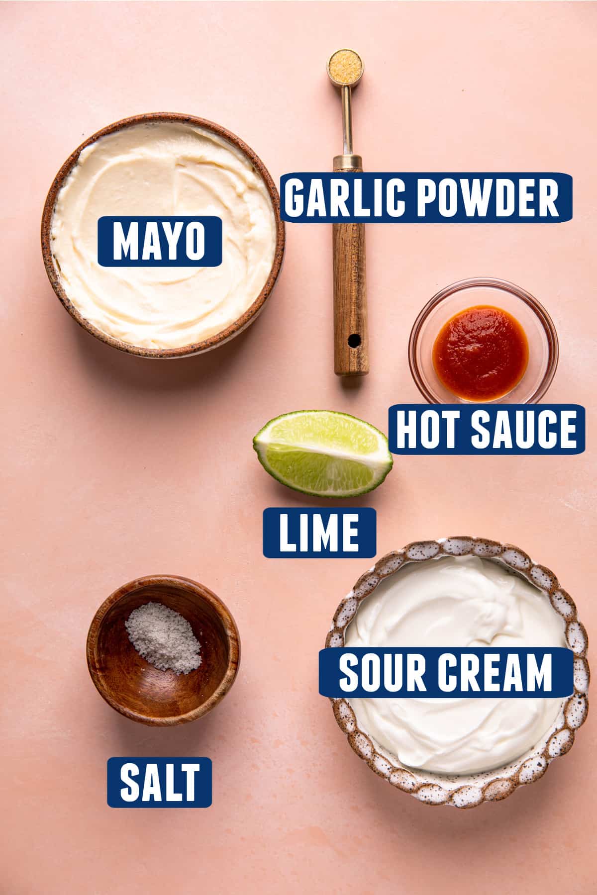 Ingredients needed to make fish taco sauce laid on the counter. 