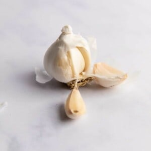 Garlic bulb split apart showing individual cloves.
