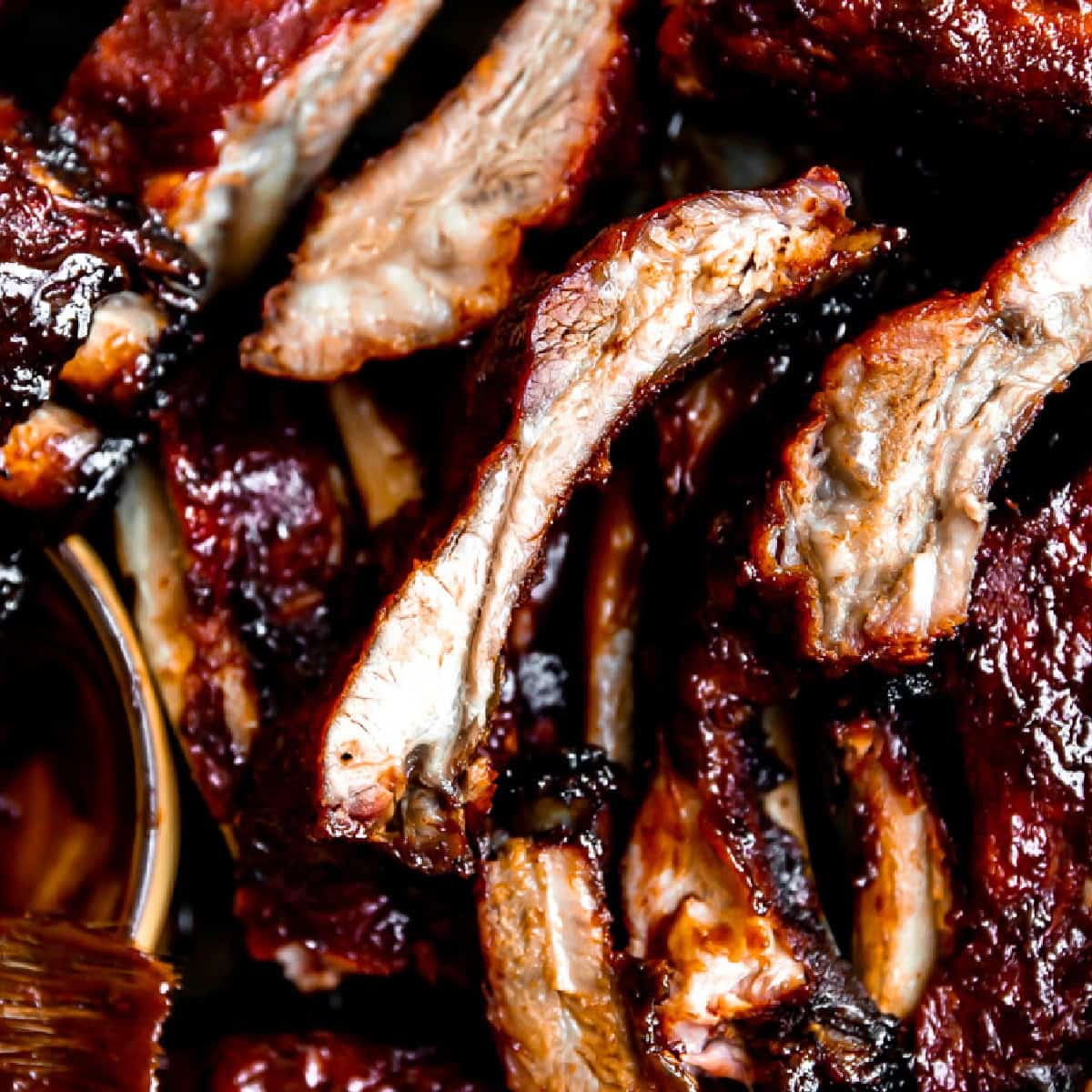 Smoked pork ribs with BBQ sauce.