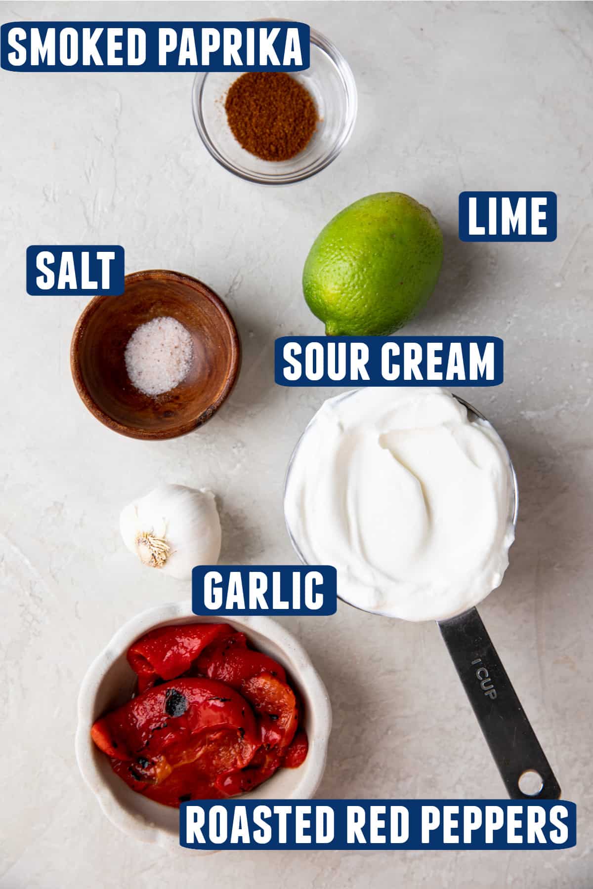 Ingredients needed to make homemade smoky red pepper crema laid out on the counter. 