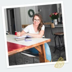 Author sitting at table smiling