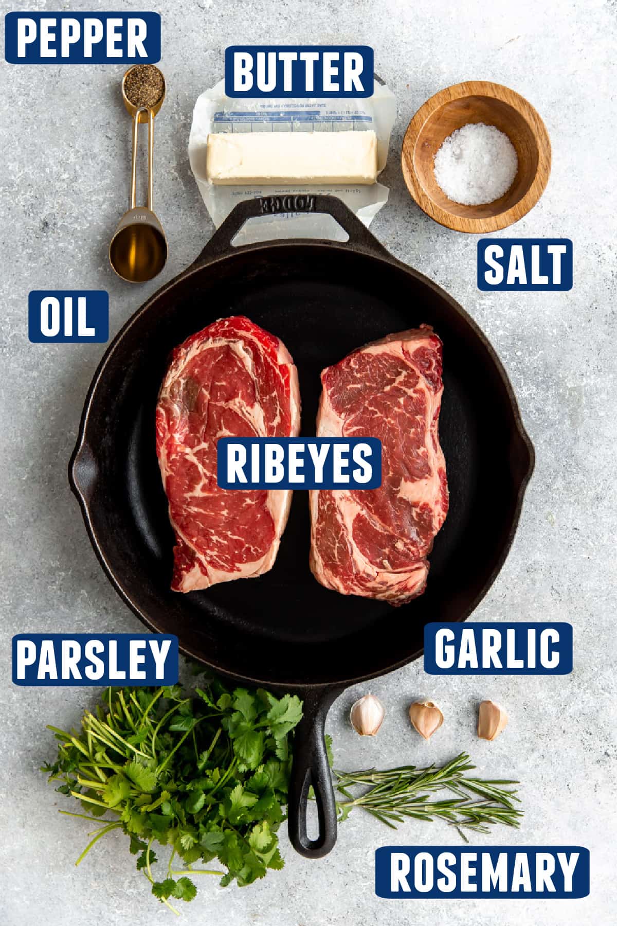 Ingredients needed to make a cast iron ribeye steak laid out on the counter.