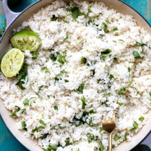 Cast iron pot filled with cooked white cilantro lime rice.