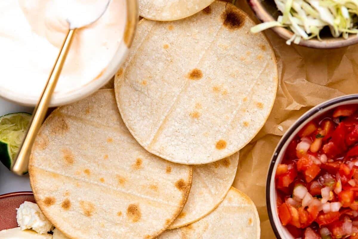 Ingredients for assembling fish tacos laid out.