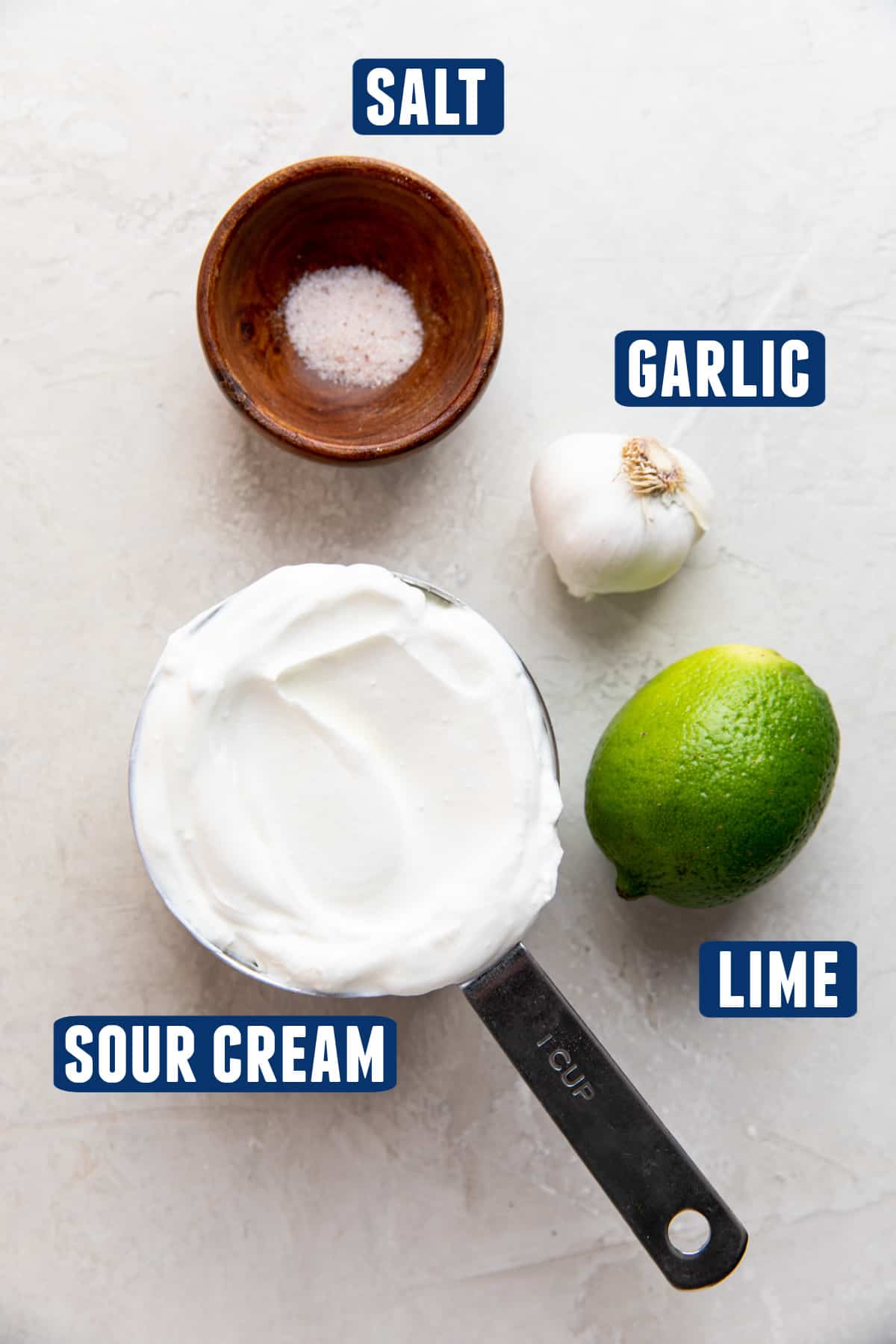 Ingredients needed to make Lime Crema laid on the counter.