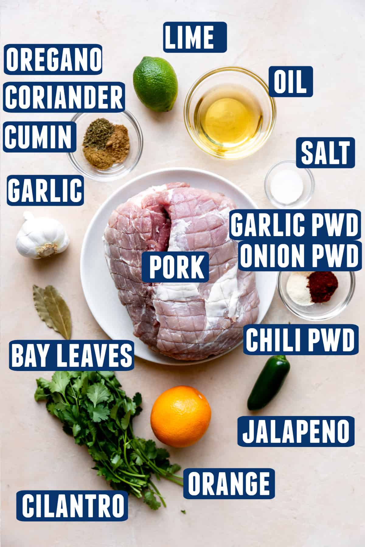 Ingredients needed to make smoked carnitas laid out on the counter.