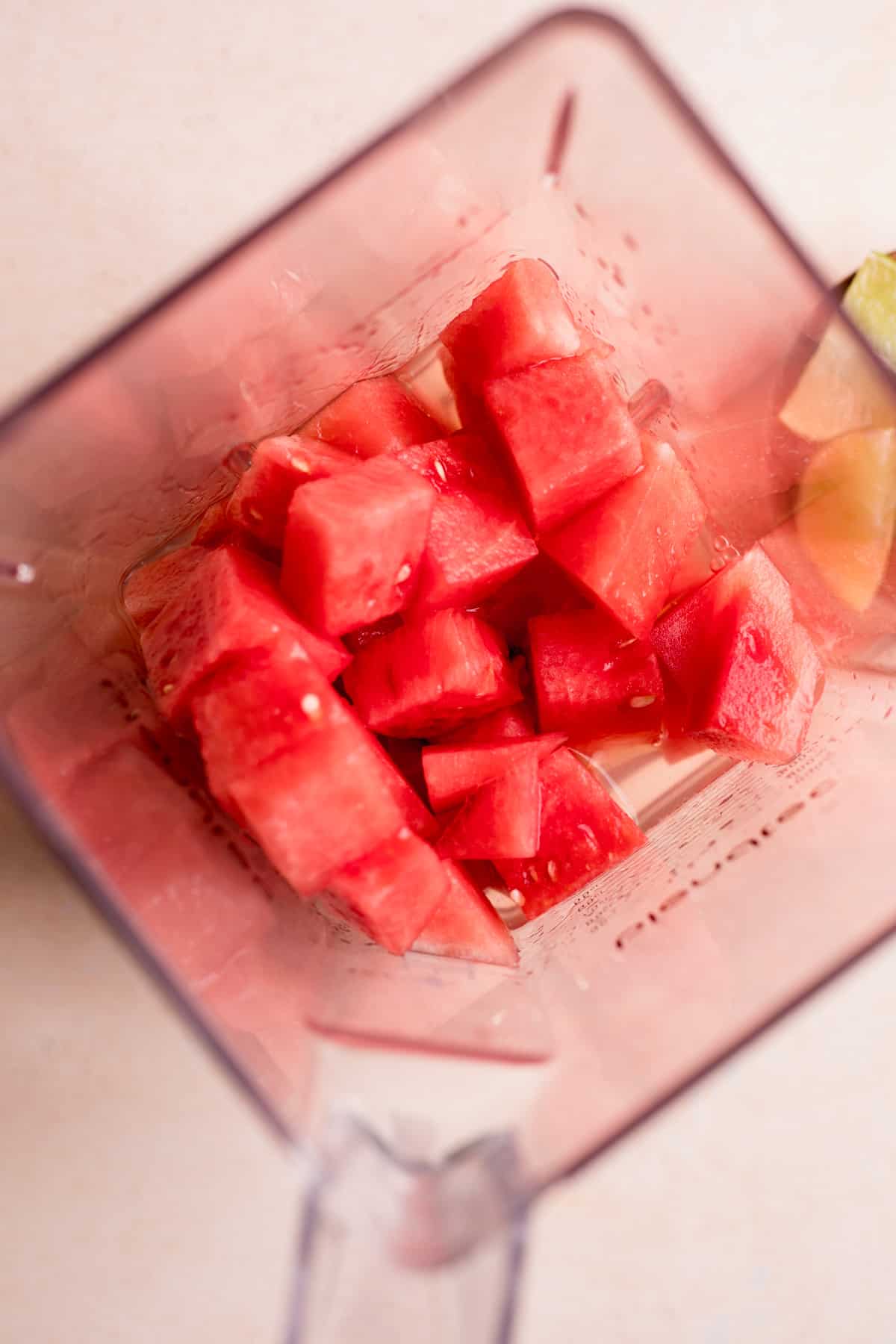 Watermelon added to a blender.