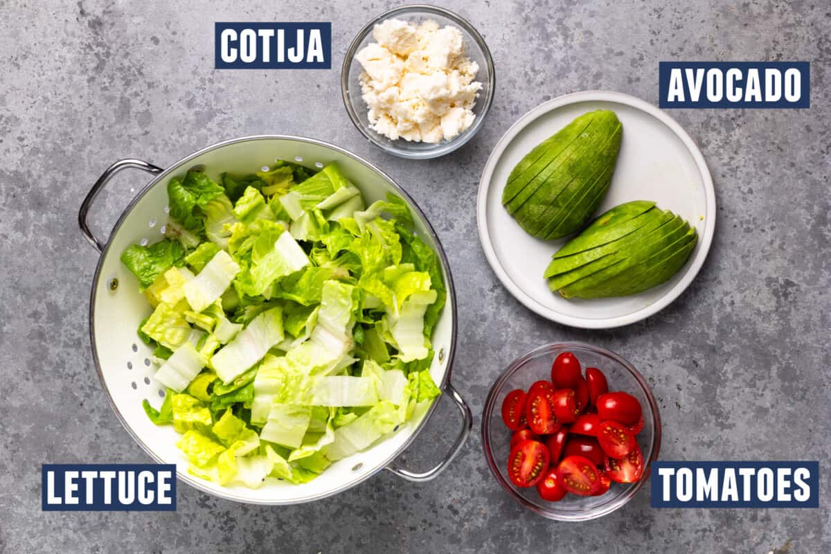 Ingredients needed to assemble a grilled chicken salad.