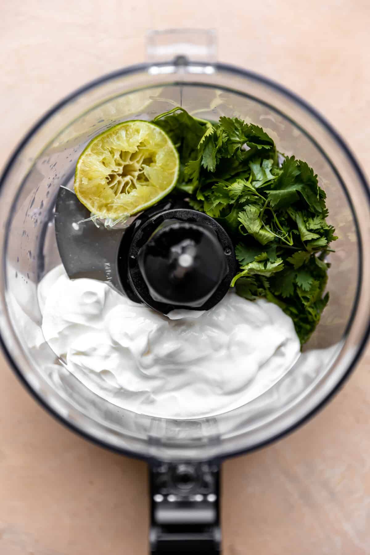 Mayo, sour cream, cilantro, and lime in a food processor. 
