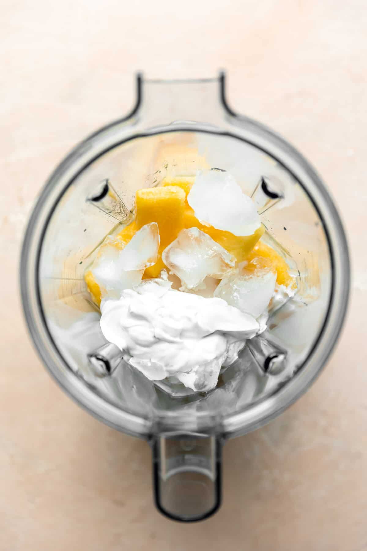 Ingredients needed for a pina colada in a blender. 