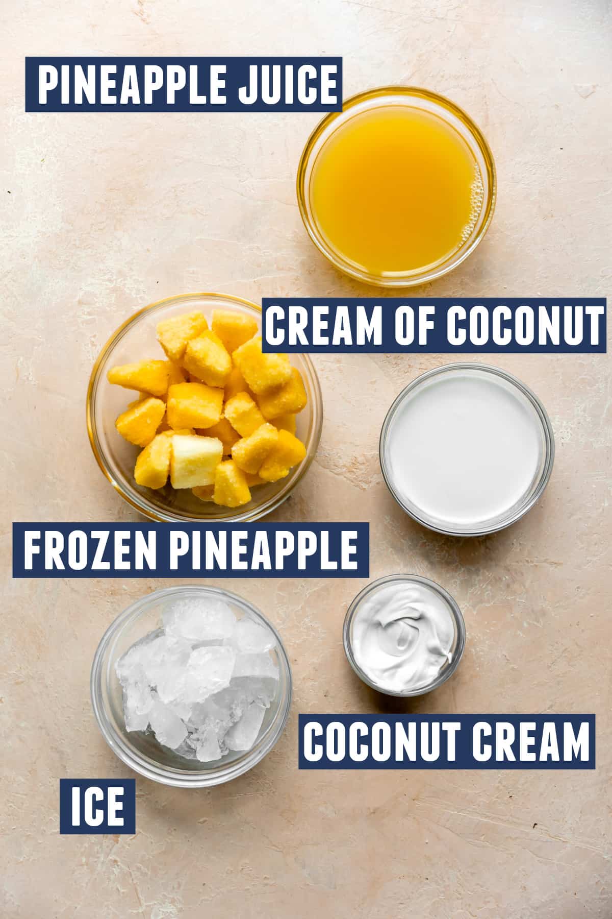 Ingredients needed to make a pina colada laid out on the counter. 