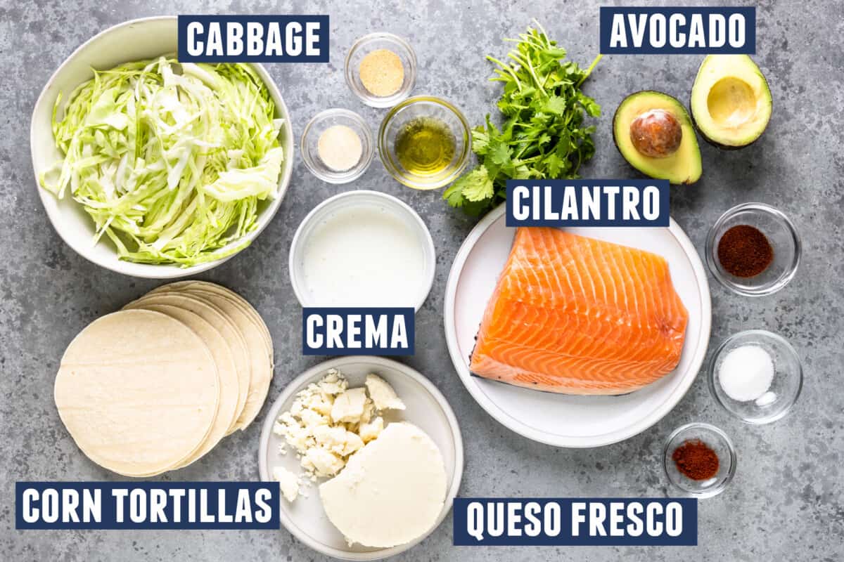 Ingredients needed to prepare salmon tacos laid out on the counter.