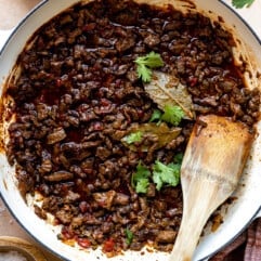 White braising skillet filled with carne picada,