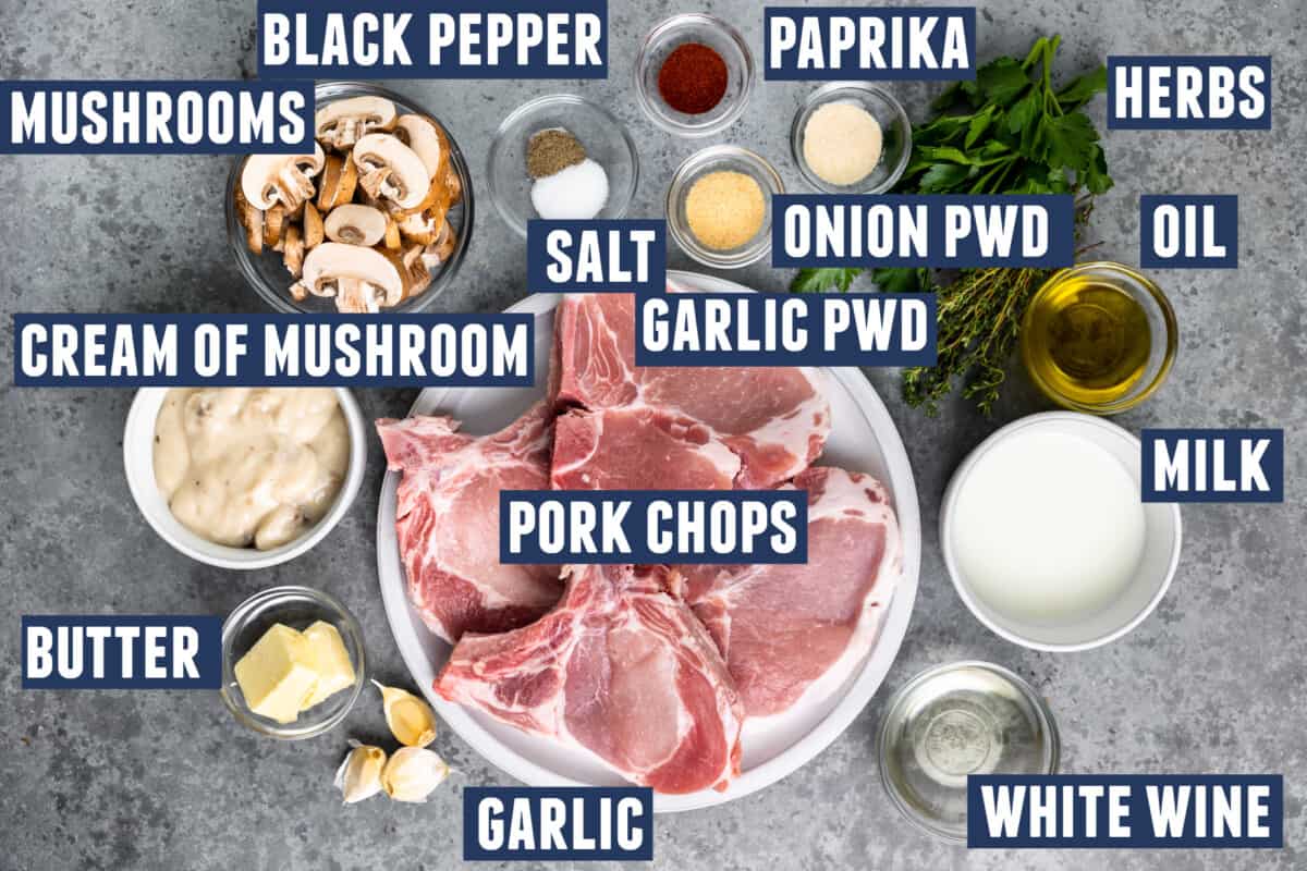 Ingredients needed to make pork chops with cream of mushroom soup laid out on the counter. 