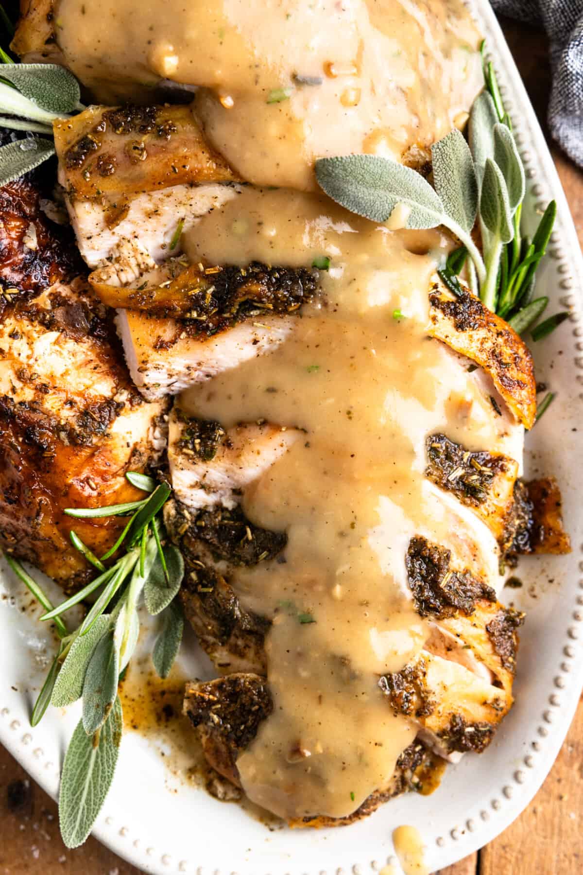 Sliced turkey breast covered with gravy. 