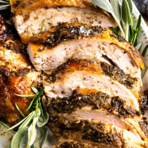 Sliced smoked turkey breast on a platter.