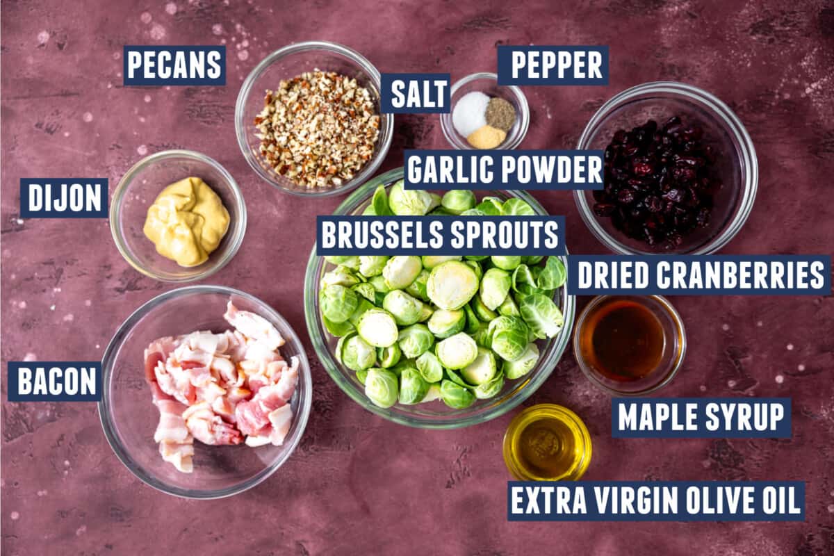 Ingredients needed to make roasted Brussels sprouts with bacon laid out on the counter. 