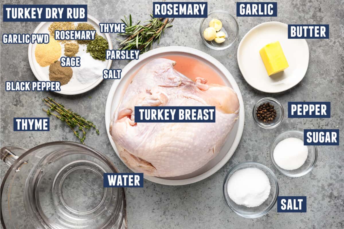 Ingredients needed to make a smoked turkey breast laid on the counter. 