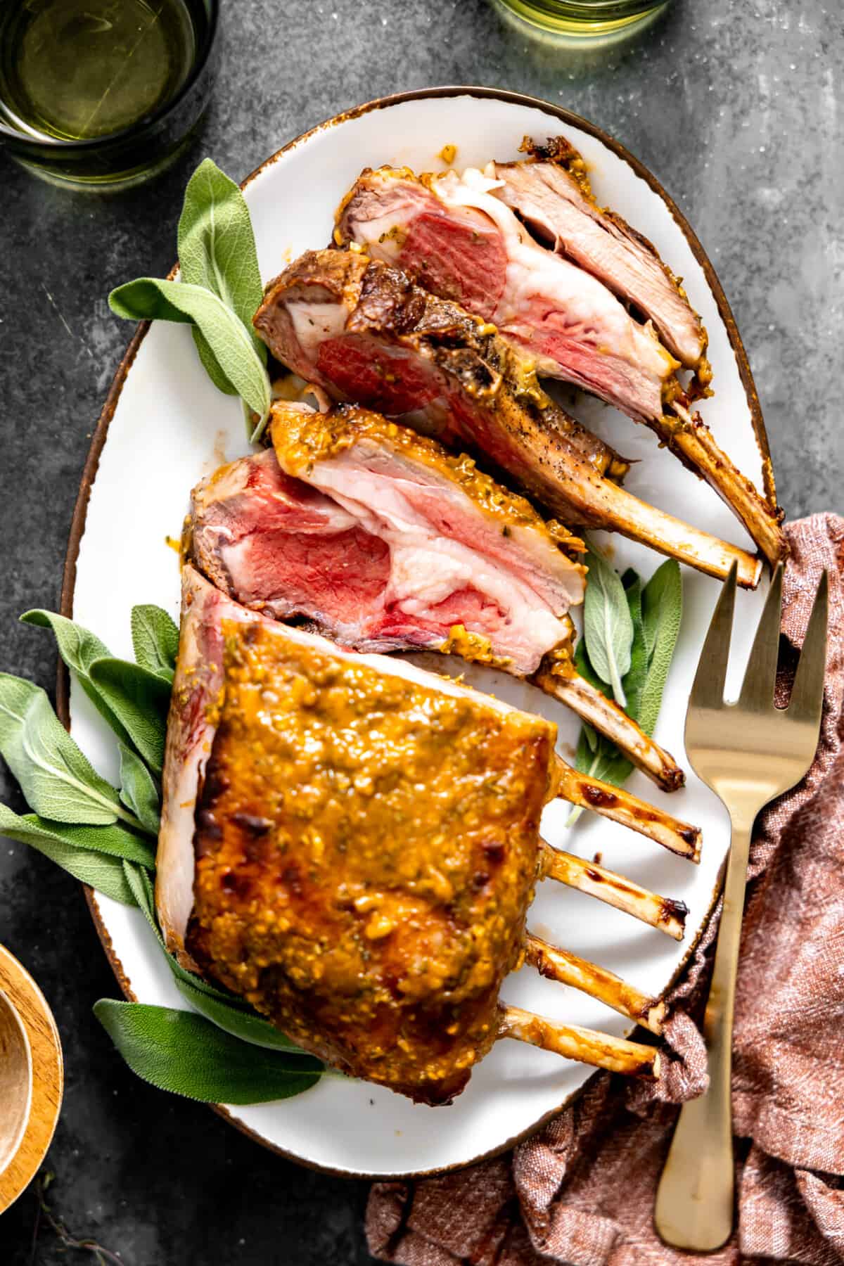 Sliced rack of lamb on a plate.