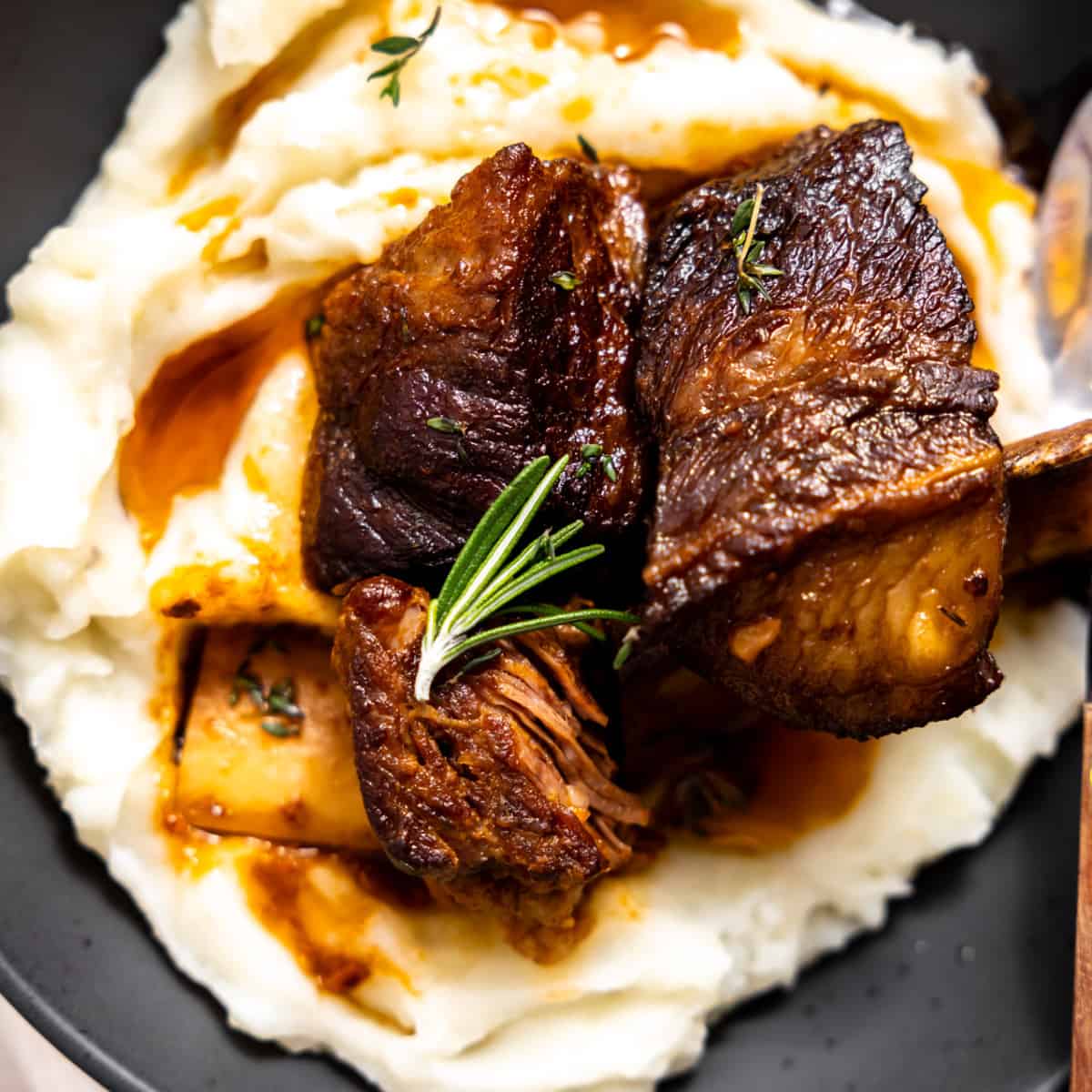 Braised short ribs with fresh herbs.