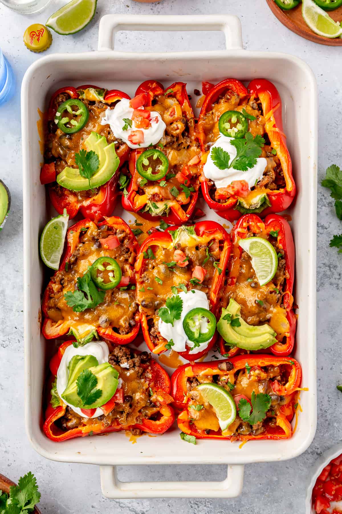 Taco stuffed peppers in a baking dish.