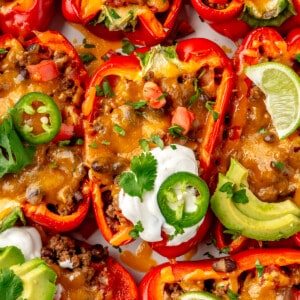 Taco stuffed bell peppers topped with sour cream.