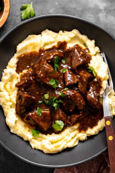 Beef tips and gravy served over mashed potatoes.