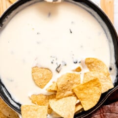 Skilled with white queso served with tortilla chips.