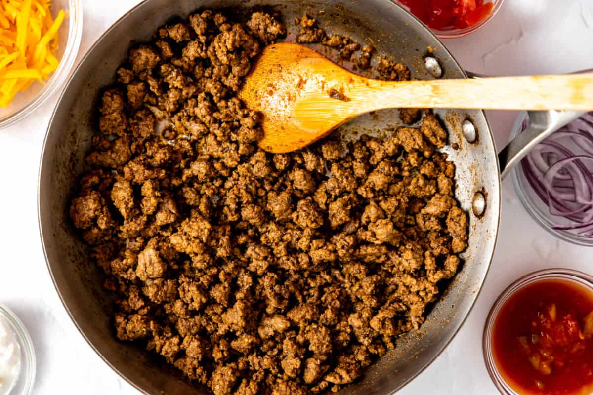 Skillet with cooked taco meat. 