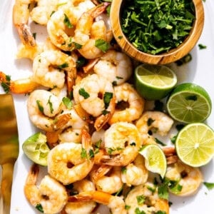 Plate filled with pan cooked cilantro lime shrimp.